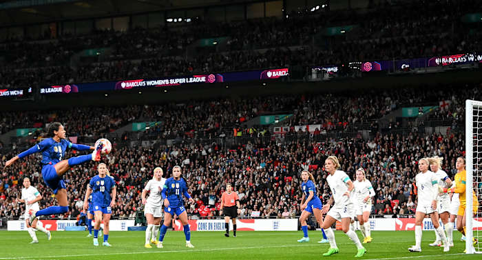 USWNT's Alana Cook controls the ball high during a friendly vs. England at Wembley Stadium.
